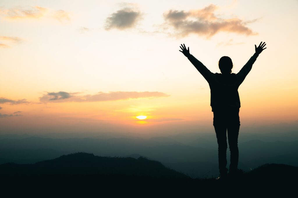 A woman raising hands up